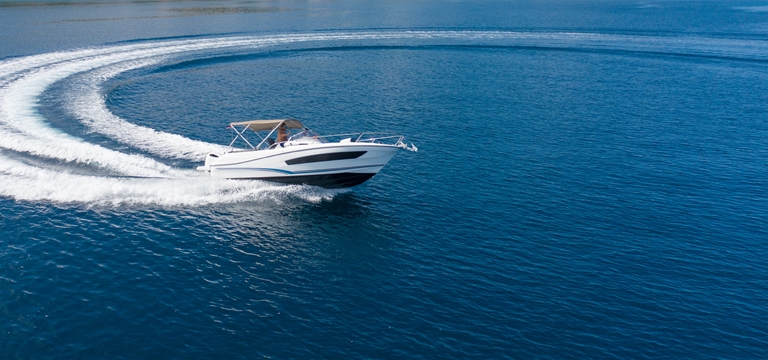 A boat in motion on the water, avoiding a boat accident concept. 